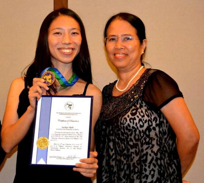 Outstanding International Student of the Philippines Ikeda Sachiyo with OSA Director Leticia E. Afuang